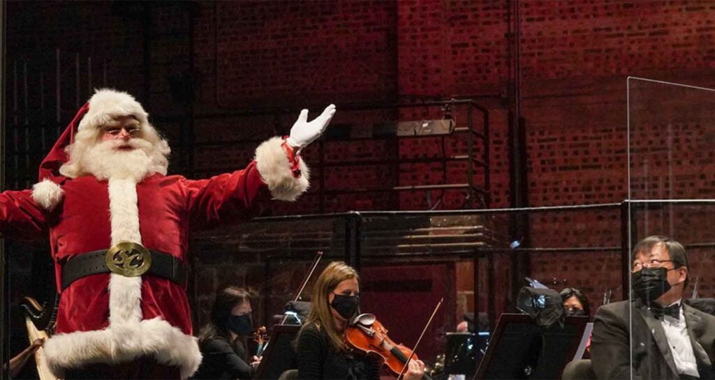 Santa Clause conducting orchestra