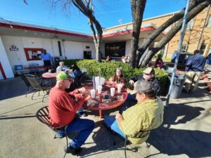 Photo of people eating outdoors at Pop's Burger Stand in Waxahachie, Texas